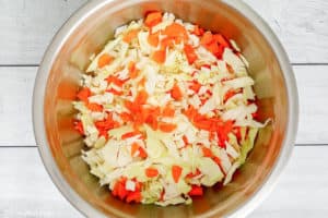 chopped cabbage and carrots in a bowl