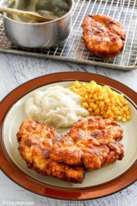 homestyle fried chicken, mashed potatoes, and corn on a plate