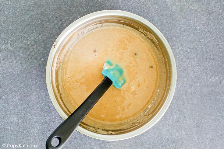 sour cream raisin pie filling and a spatula in a bowl