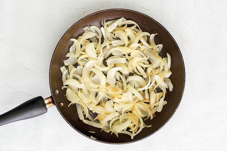 cooked sliced Vidalia onions in a skillet