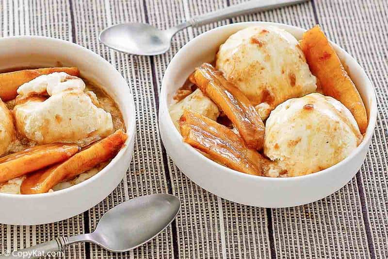 two bowls of bananas foster dessert and two spoons