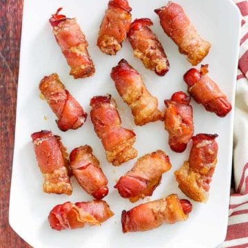 overhead view of bacon wrapped little smokies on a platter