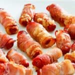 brown sugar bacon wrapped little smokies on a white platter