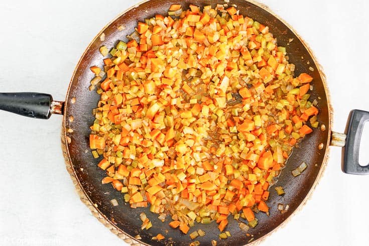 cooked chopped vegetables in a skillet