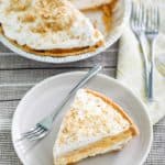 double layer pumpkin pie and slice on a plate
