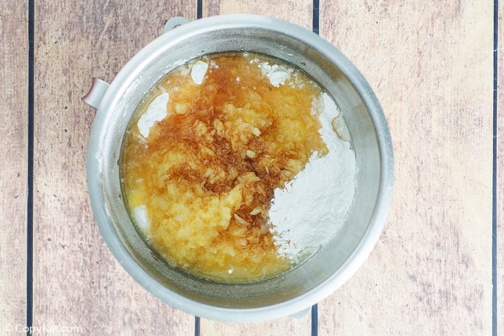 pineapple angel food cake ingredients in a mixing bowl