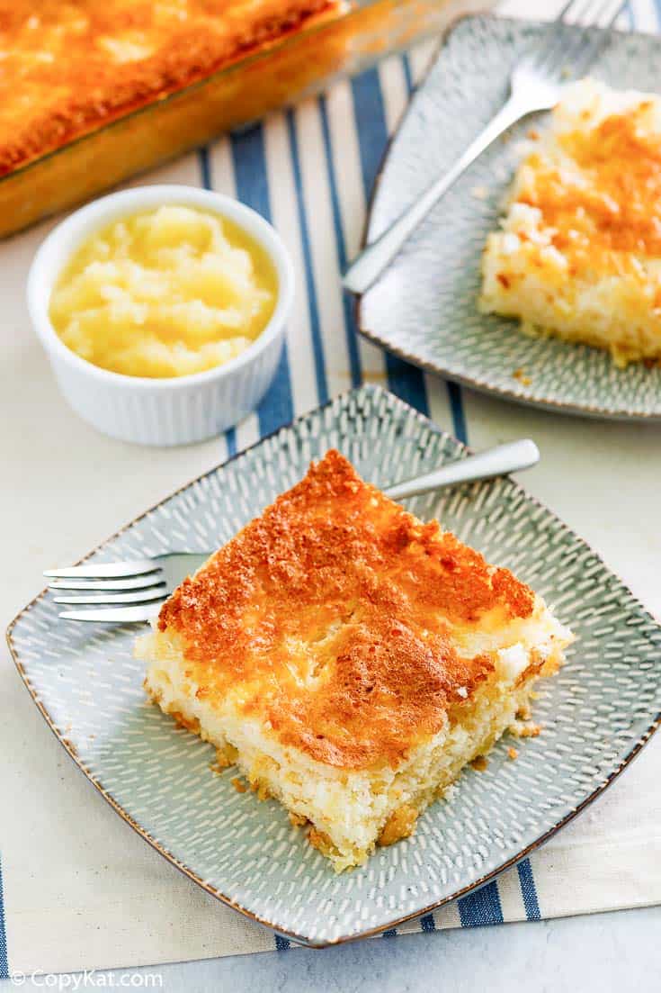 two slices of pineapple angel food cake and a bowl of crushed pineapple