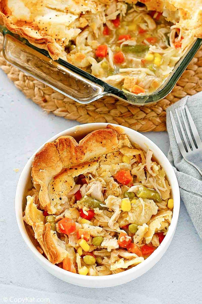 overhead view of chicken pot pie in a bowl and baking dish