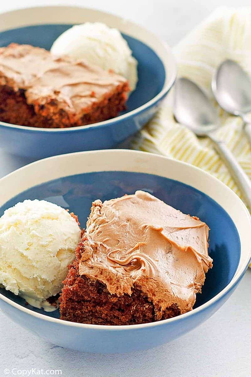 two bowls of homemade chocolate Coca Cola cake and vanilla ice cream
