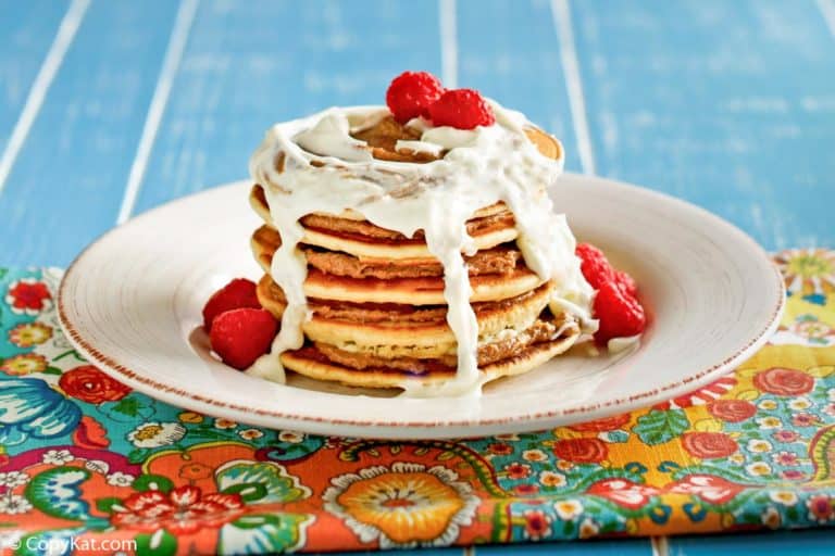 IHOP-style cinnamon stack pancakes with frosting drizzle.