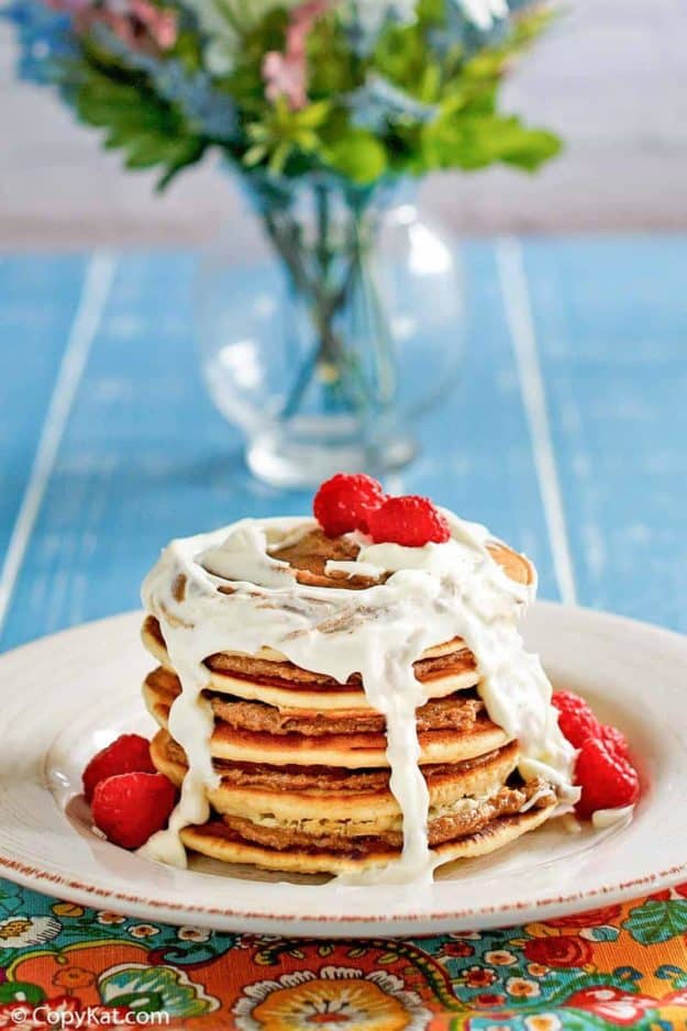 a stack of homemade IHOP Cinnastack pancakes with cream cheese icing