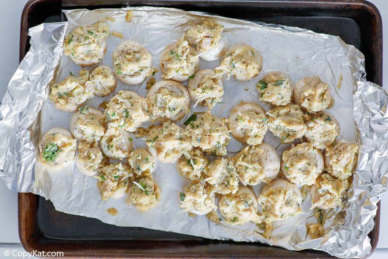 stuffed mushrooms on a baking sheet before being baked