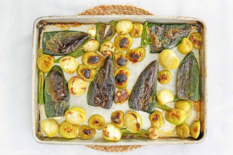 roasted peppers and garlic on a baking sheet