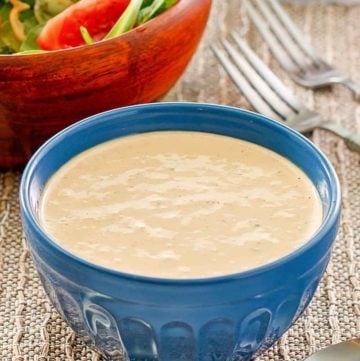 a bowl of homemade Russian dressing and a salad
