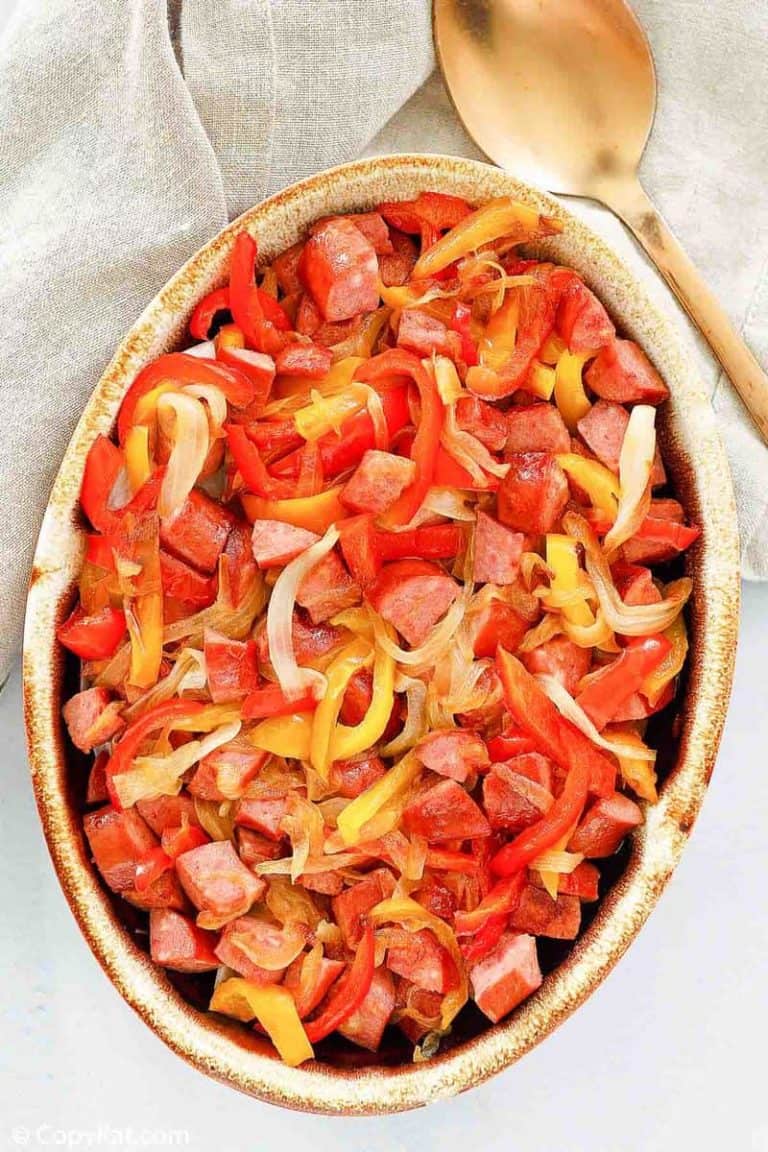 overhead view of smoked sausage and peppers in a serving dish
