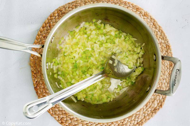 cooked onions and celery in a pan