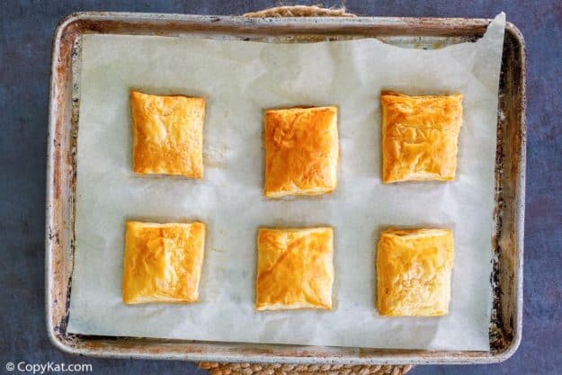 six baked puff pastry squares