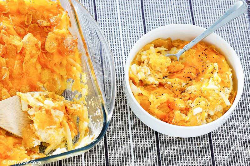 cheesy hashbrown potato casserole in a bowl and casserole dish