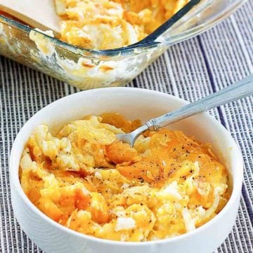 cheesy hashbrown potato casserole in a bowl and baking dish