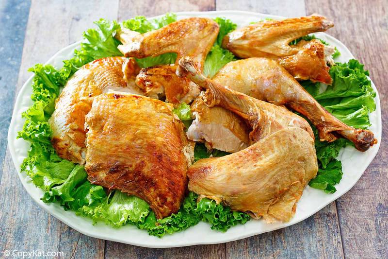 cut up deep fried turkey and lettuce on a platter