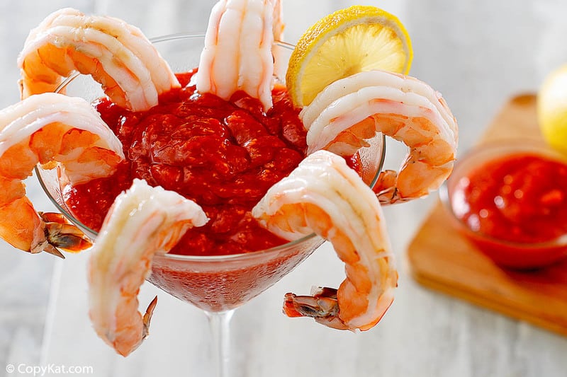 cooked shrimp and homemade cocktail sauce in a martini glass