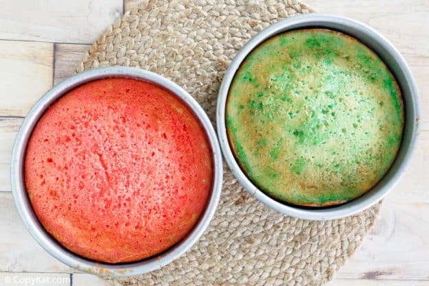 red and green Jello poke cake layers in the pans
