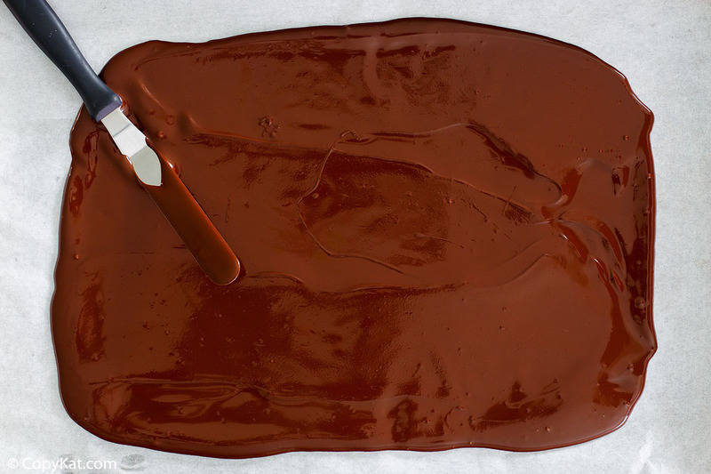 melted peppermint chocolate spread out on waxed paper
