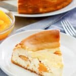 a slice of homemade Olive Garden Peaches and Cream Cheesecake