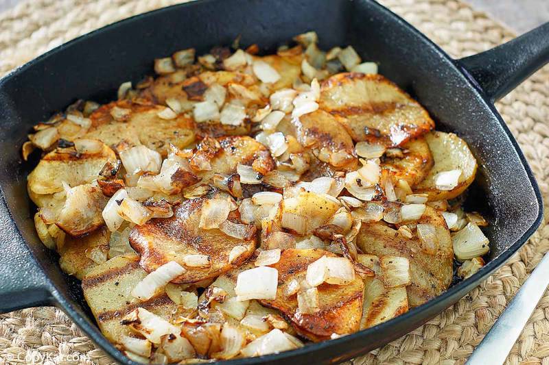 pan fried potatoes and onions in a cast iron skillet