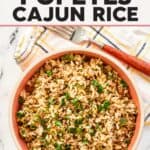 A bowl of rice with Cajun spices and ground beef.