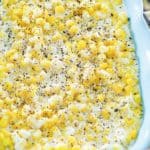 homemade Rudy's creamed corn in a blue serving dish