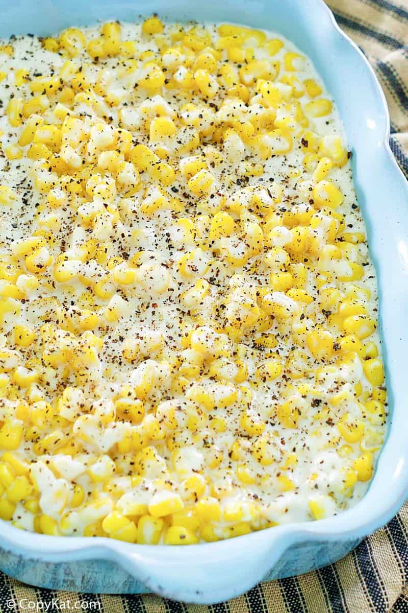 homemade Rudy's creamed corn in a blue serving dish