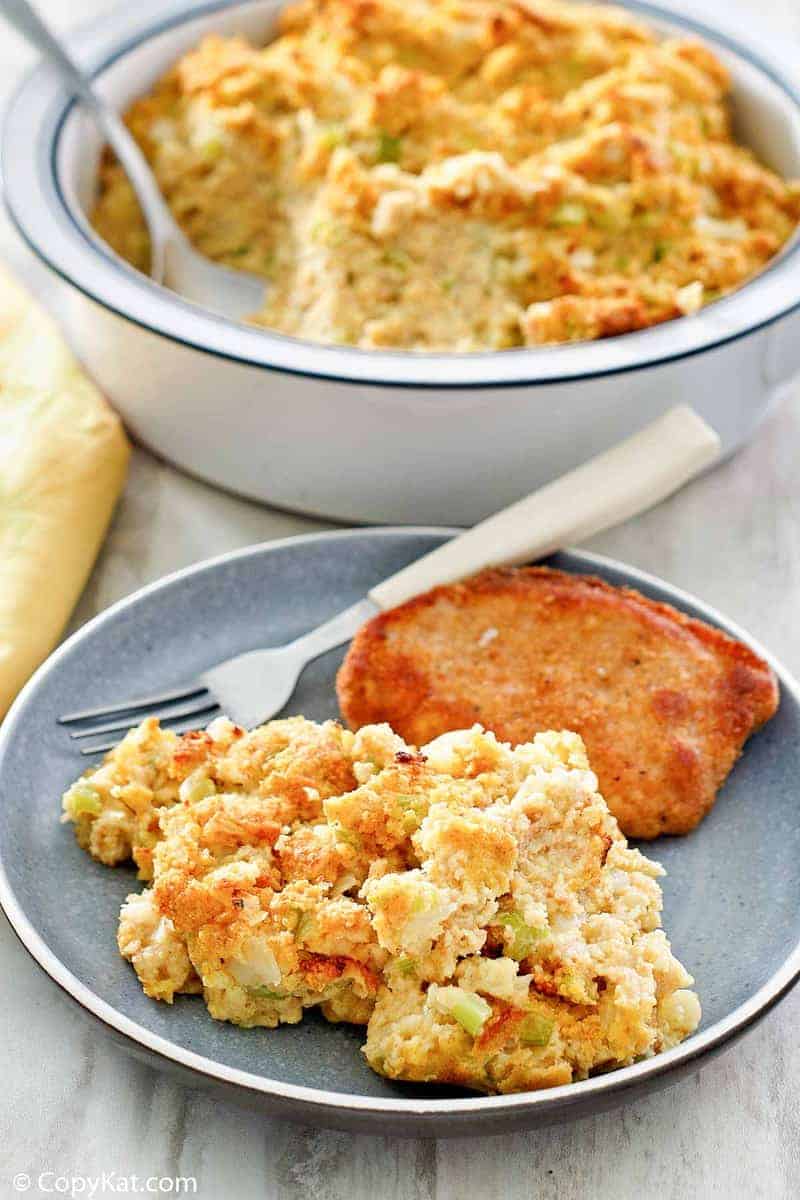 southern cornbread dressing on a plate and in a baking dish