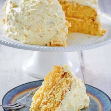 Ambrosia Cake on a cake stand and a slice on a plate