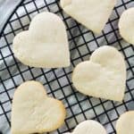 overhead view of heart-shaped cake mix cookies on a cooling rack