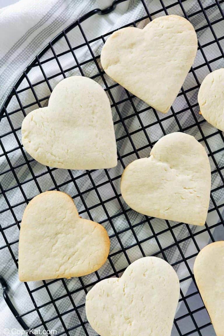 overhead view of heart-shaped cake mix cookies on a cooling rack