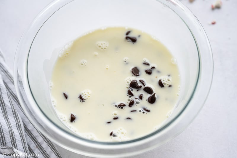 chocolate chips, corn syrup, sugar, and heavy cream in a bowl