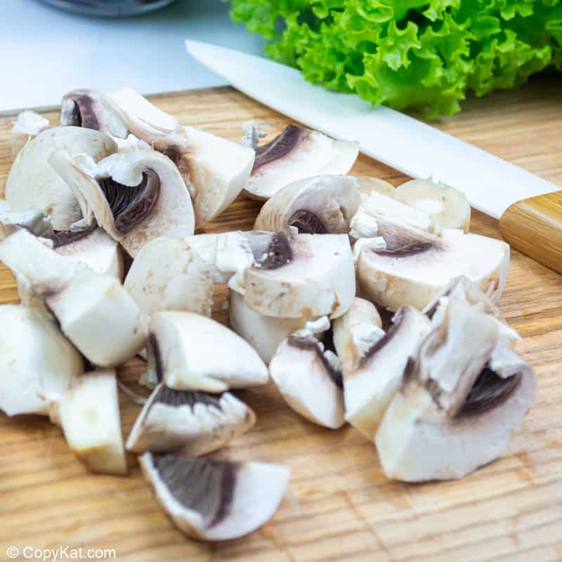 chopped mushrooms on a cutting board