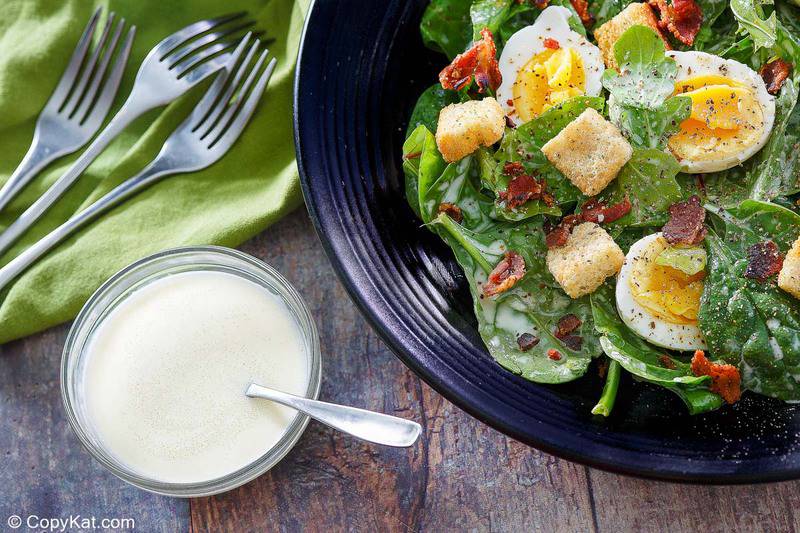 homemade Commander's Palace salad and dressing in bowls