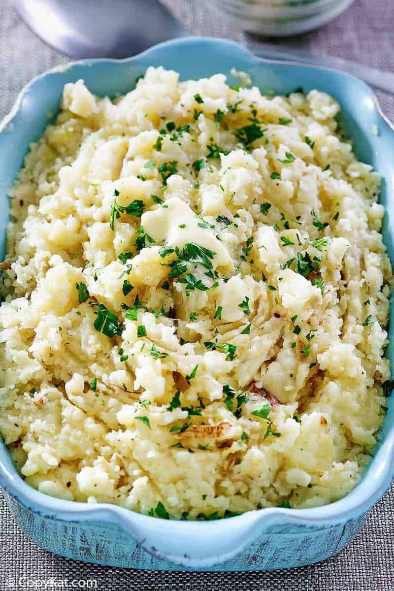 homemade Cracker Barrel mashed potatoes in a blue serving dish