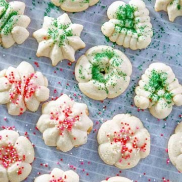 cream cheese spritz cookies on parchment paper