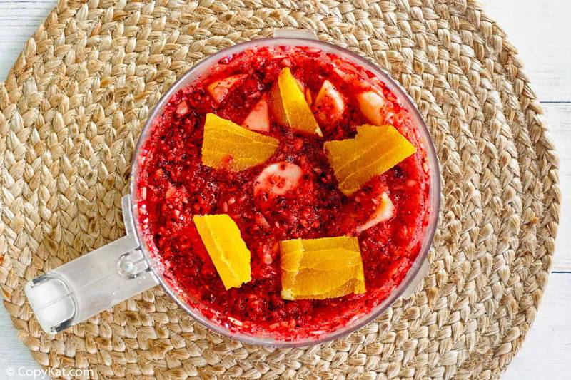 cranberry relish with orange and apple in a food processor bowl