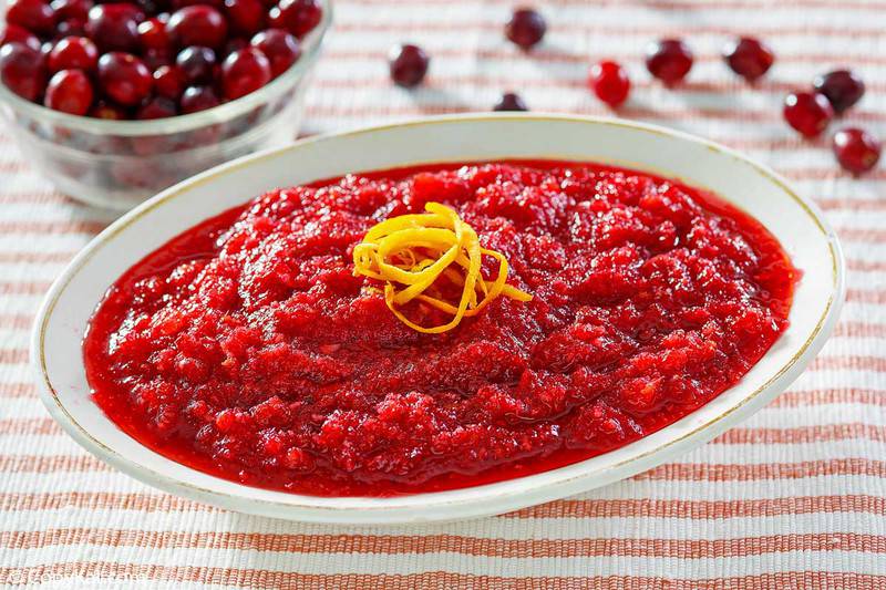 a bowl of homemade Luby's cranberry relish and a bowl of cranberries