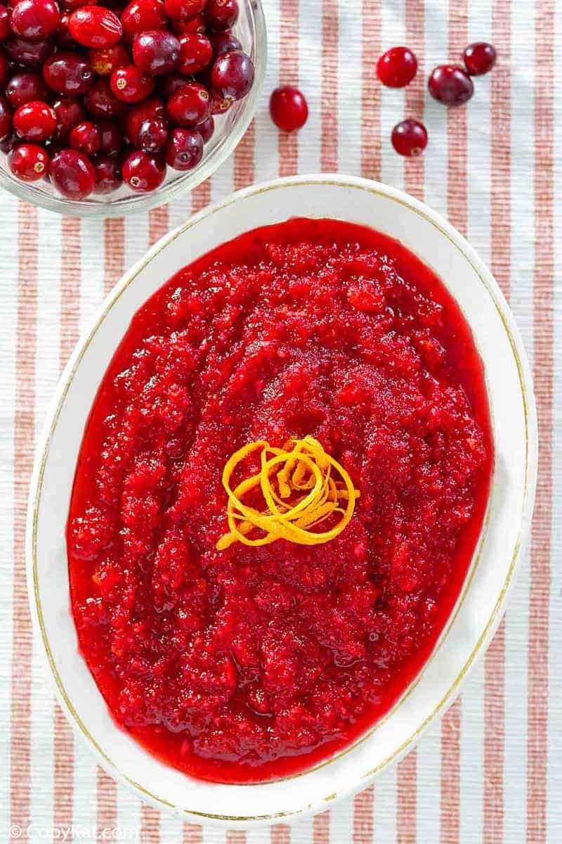 overhead view of a bowl of homemade Luby's cranberry relish and fresh cranberries