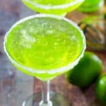 two Mountain Dew margaritas and limes