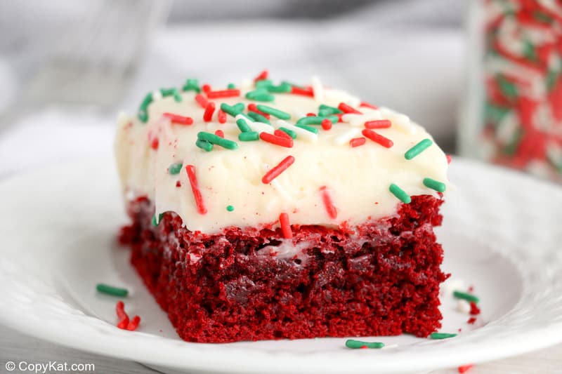 red velvet brownie with cream cheese frosting on a white plate
