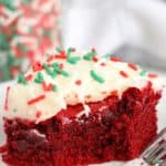 red velvet brownie with cream cheese frosting with a bite taken out of it