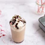 homemade Starbucks peppermint mocha topped with whipped cream and chocolate syrup