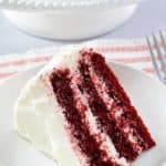 a slice of homemade Waldorf Astoria red velvet cake on a plate