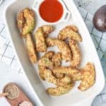 overhead view of air fryer avocado fries and ketchup in a serving dish